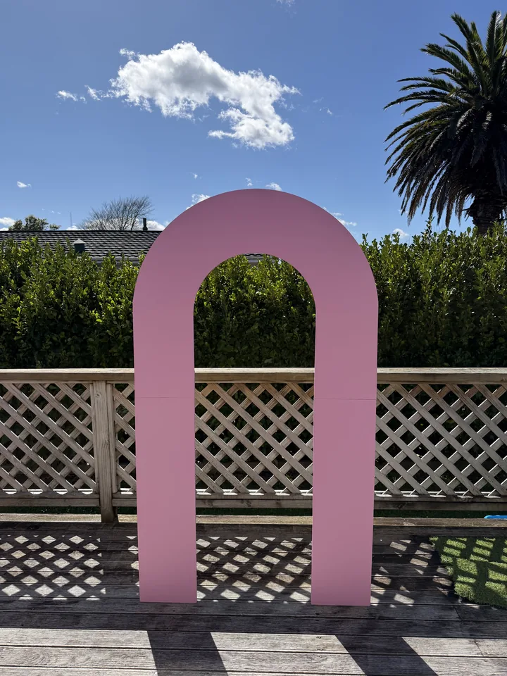 Pink hollow arch backdrop available for individual hire.