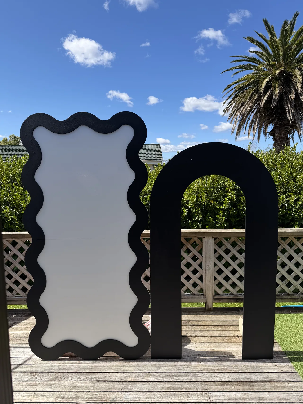 Black hollow arch and black and white squiggle backdrop from the Essence of Raz hire collection.