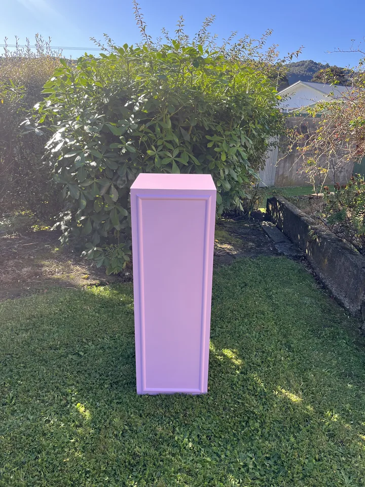 Tall pink square cake stand and plinth from the hire collection.