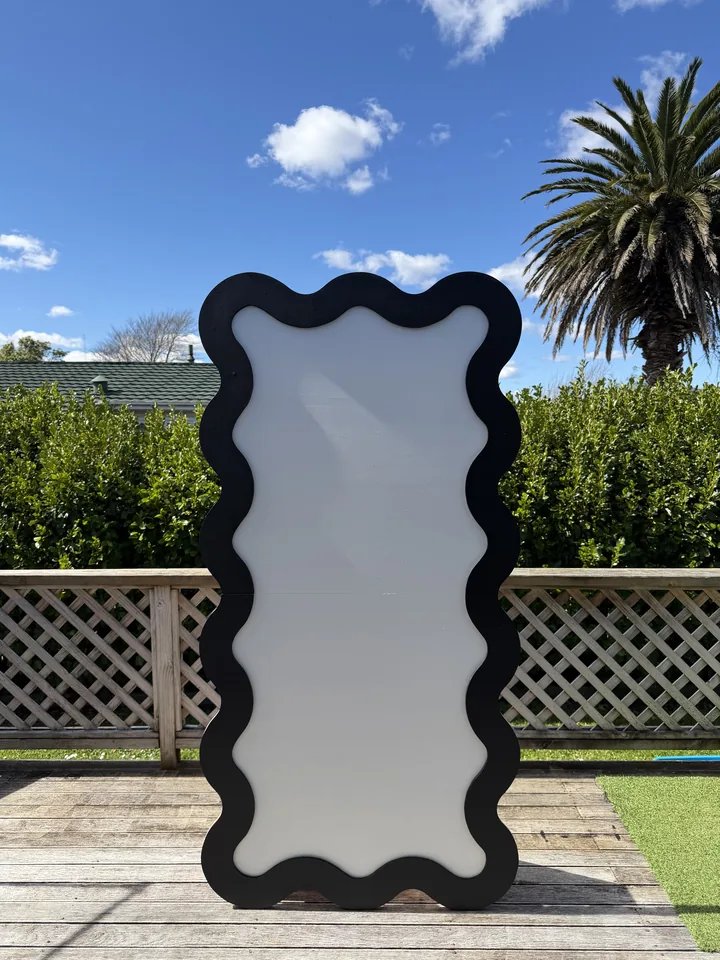 Black and white collapsible squiggle backdrop available for party hire.