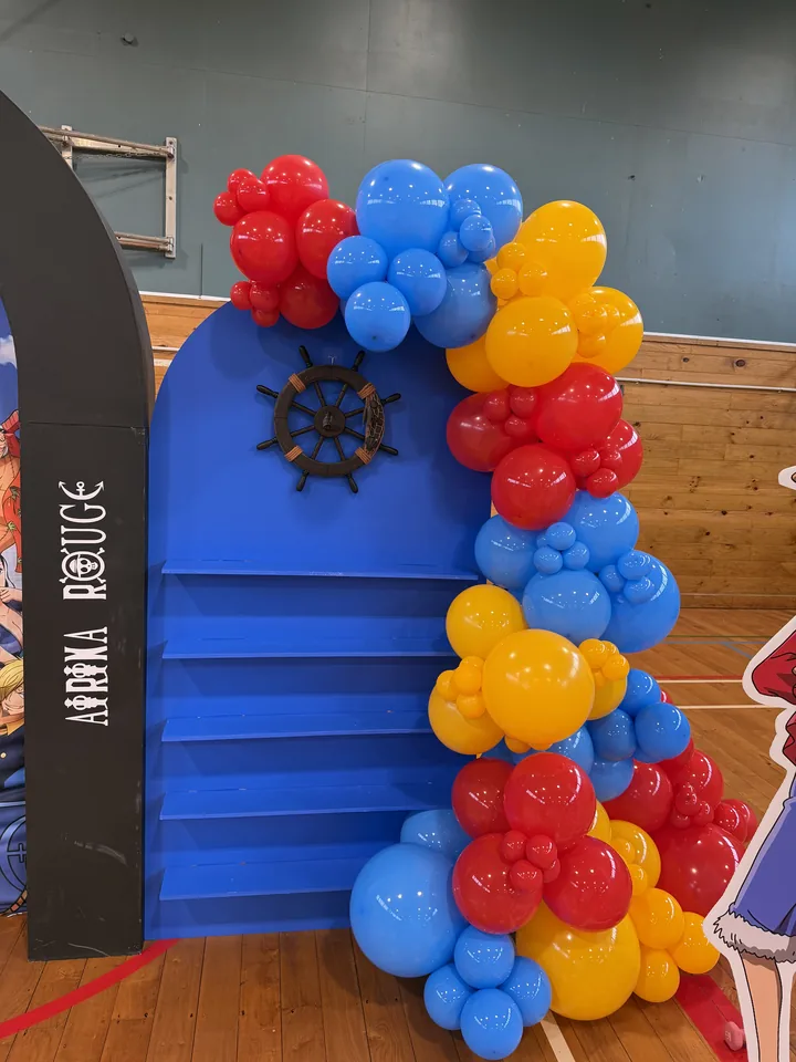 Blue treat wall with red, blue and yellow balloon styling.
